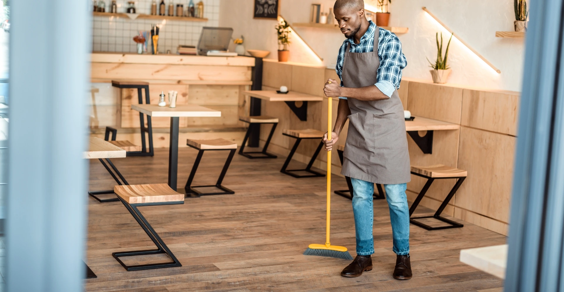 Commercial kitchen being deep-cleaned by a professional cleaning crew
